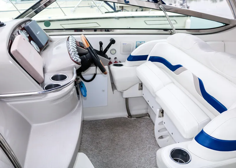 Slide: The Image of 2003 Formula 370 Super Sport boat interior with white and blue seating. - 10