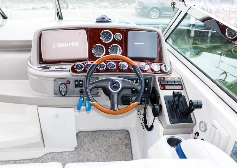 Slide: The Image of 2003 Formula 370 Super Sport boat cockpit with Garmin navigation system. - 12