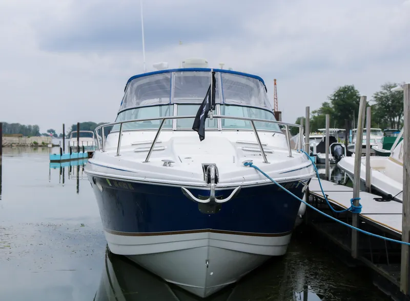 Slide: The Image of 2003 Formula 370 Super Sport boat docked at a marina. - 2