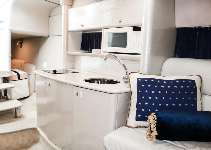 Slide: The Image of 2003 Formula 370 Super Sport interior with kitchenette and seating area. - 22