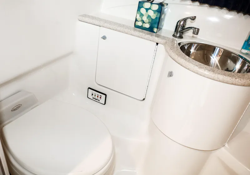 Slide: The Image of 2003 Formula 370 Super Sport boat bathroom with sink and toilet. - 23