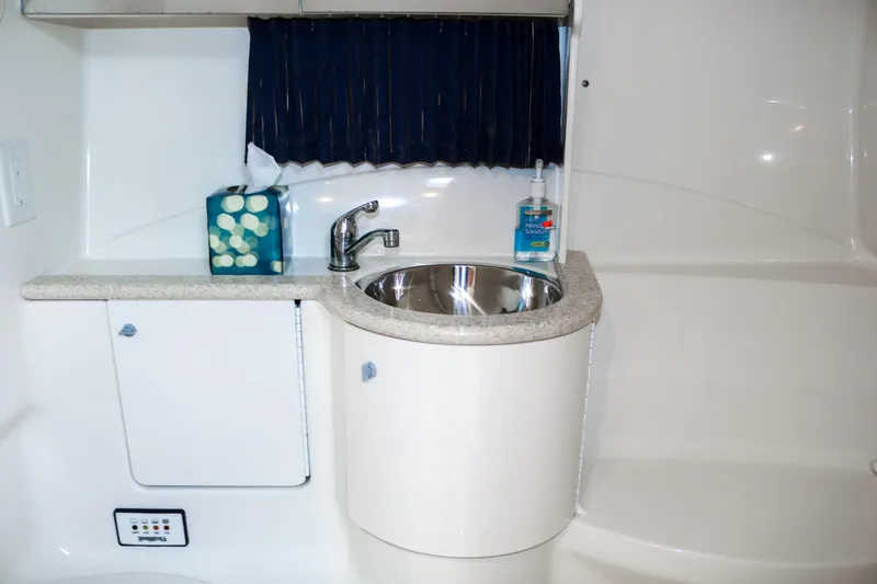Slide: The Image of 2003 Formula 370 Super Sport boat bathroom sink and countertop. - 24