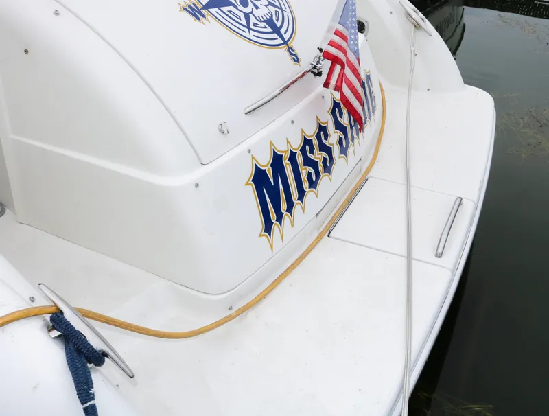 Slide: The Image of 2003 Formula 370 Super Sport boat with American flag and Miss name on stern. - 4