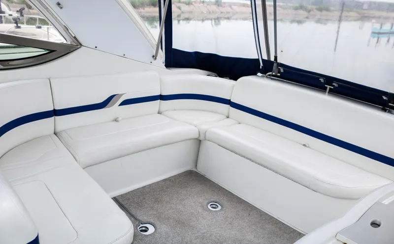 Slide: The Image of 2003 Formula 370 Super Sport boat interior with white and blue seating. - 5