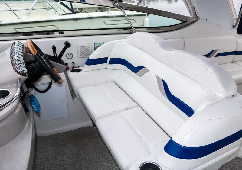 Slide: The Image of 2003 Formula 370 Super Sport boat interior with white and blue seating. - 9