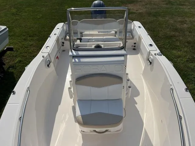 Slide: The Image of 2019 Robalo R180 boat interior with seating and console, viewed from above. - 10