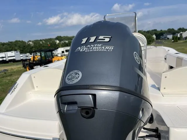 Slide: The Image of 2019 Robalo R180 boat with 115 Atlantic outboard motor, outdoor setting. - 5