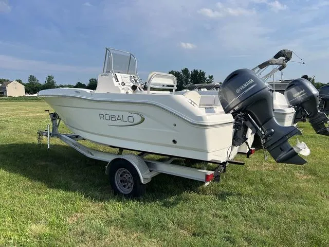 Slide: The Image of 2019 Robalo R180 boat on trailer with Yamaha outboard motor. - 6