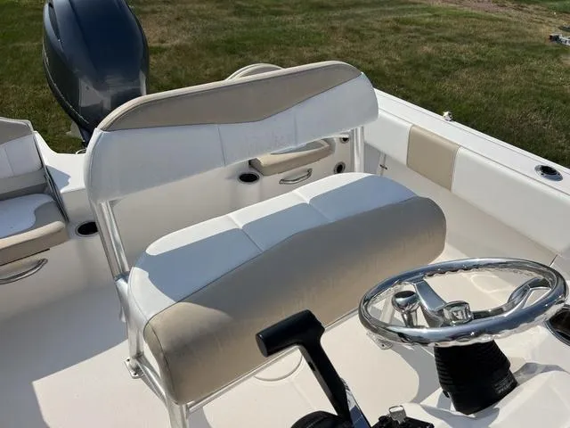 Slide: The Image of 2019 Robalo R180 boat interior with steering wheel and seating. - 8