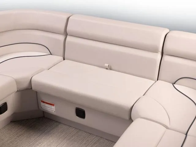 Slide: The Image of 2024 SunCatcher Select 22SS boat interior with beige cushioned seating. - 18