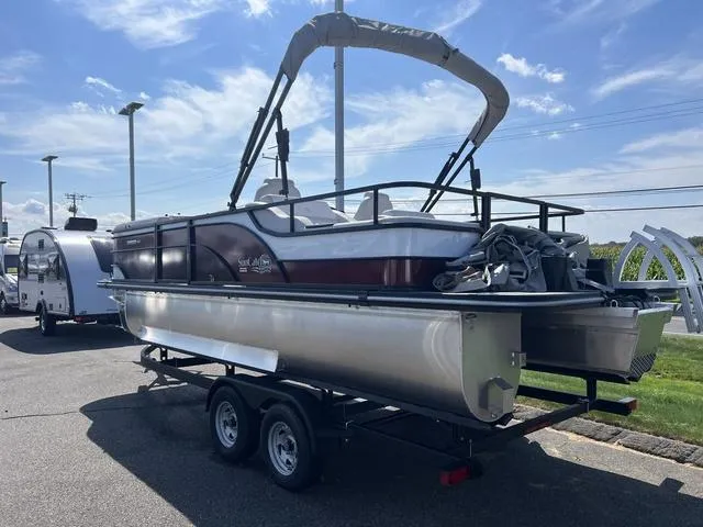 Slide: The Image of 2024 SunCatcher Select 22SS boat console with smartphone charging. - 3