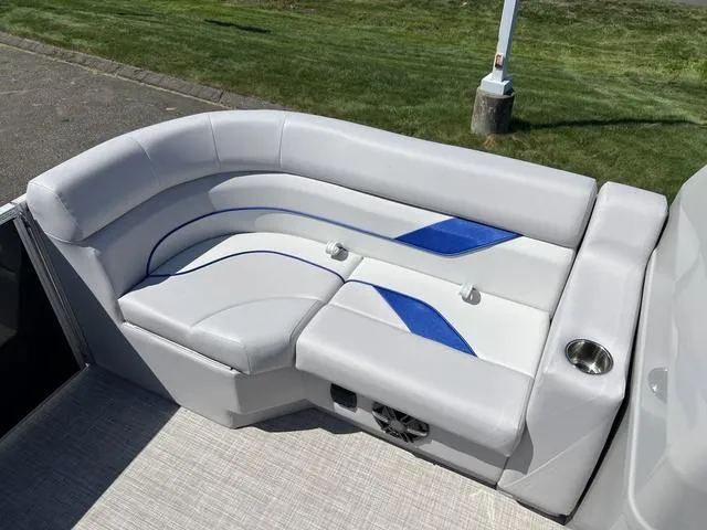 Slide: The Image of 2024 SunCatcher Select 18C boat seating with white and blue upholstery. - 12