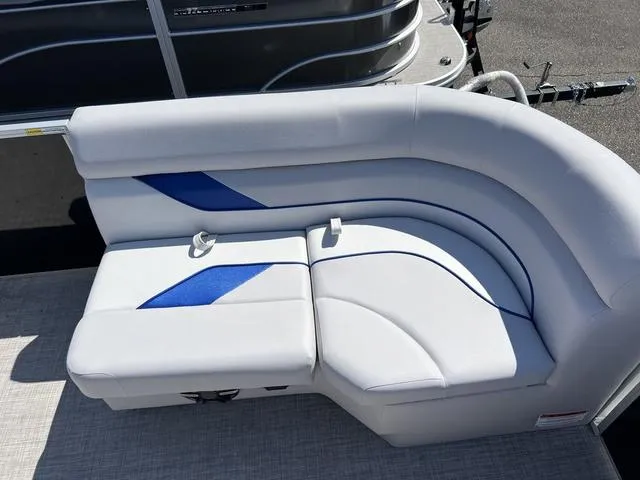 Slide: The Image of 2024 SunCatcher Select 18C boat seating with blue accents and modern design. - 13