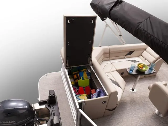 Slide: The Image of 2024 SunCatcher Select 18C pontoon boat with open storage and seating area. - 19