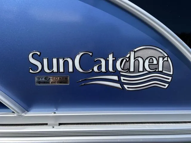 Slide: The Image of 2024 SunCatcher Select 18C boat dashboard with steering wheel and control panel. - 8