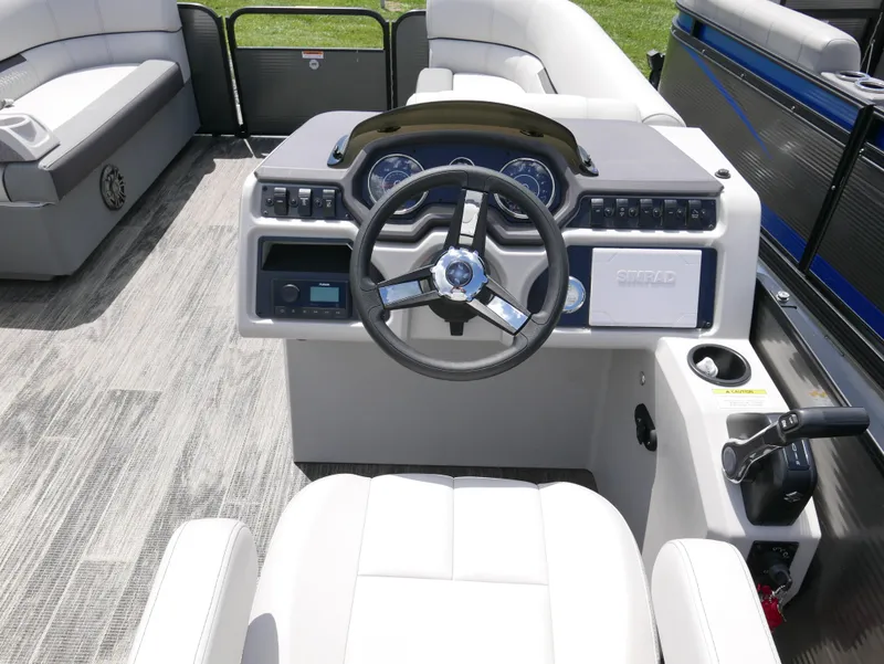 Slide: The Image of 2023 Godfrey SWEETWATER 2086 boat dashboard with steering wheel and seating. - 8