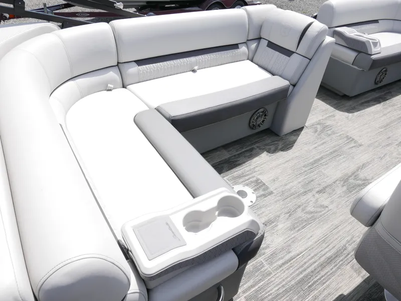 Slide: The Image of 2023 Godfrey SWEETWATER 2086 boat interior with white and gray seating. - 9
