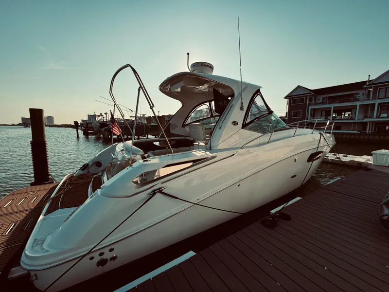 Slide: The Image of 2008 Sea Ray 350 Sundancer docked at a marina. - 1