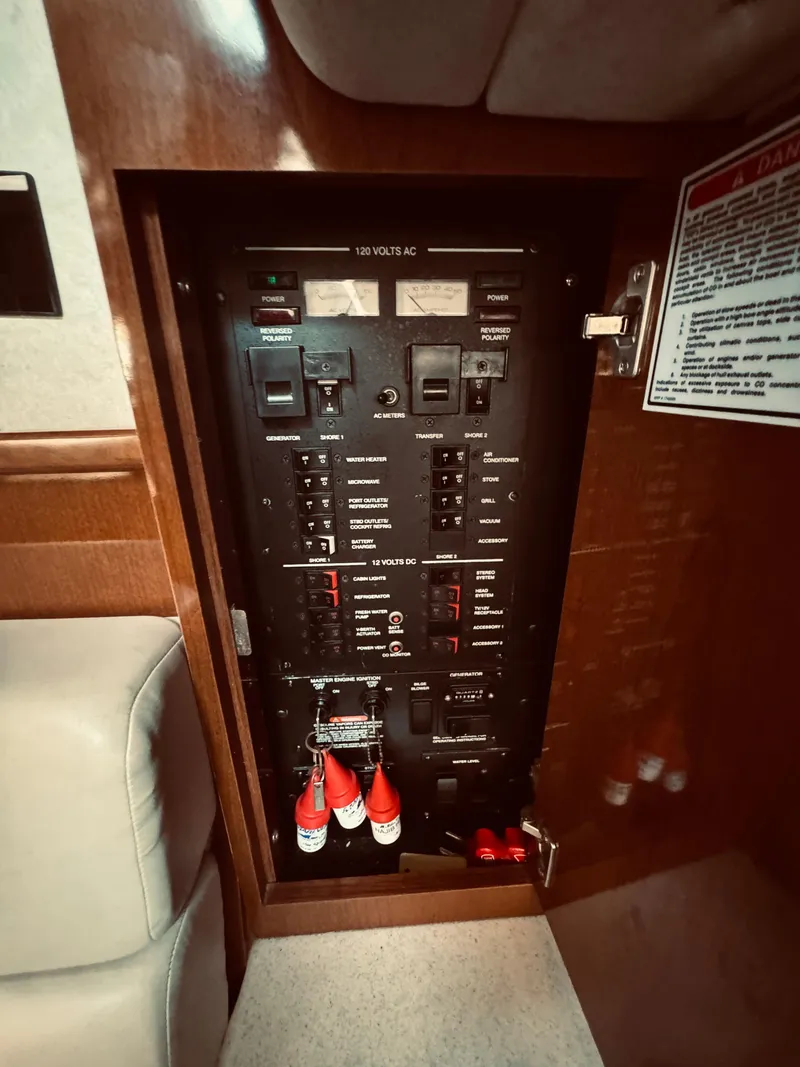 Slide: The Image of Electrical control panel on a 2008 Sea Ray 350 Sundancer boat. - 21