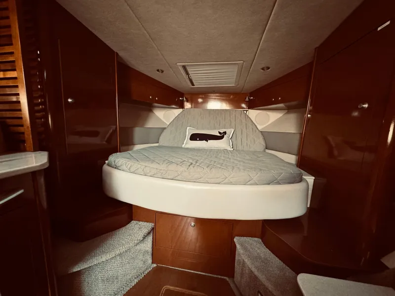 Slide: The Image of Interior cabin of 2008 Sea Ray 350 Sundancer with bed and whale pillow. - 23