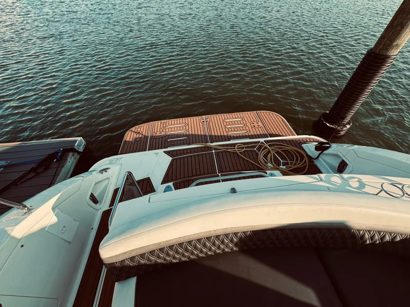 Slide: The Image of 2008 Sea Ray 350 Sundancer at dock, view of swim platform and water. - 5