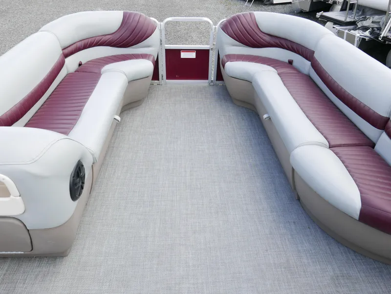 Slide: The Image of 2004 Tracker PB22OB pontoon boat interior with maroon and gray seating. - 4