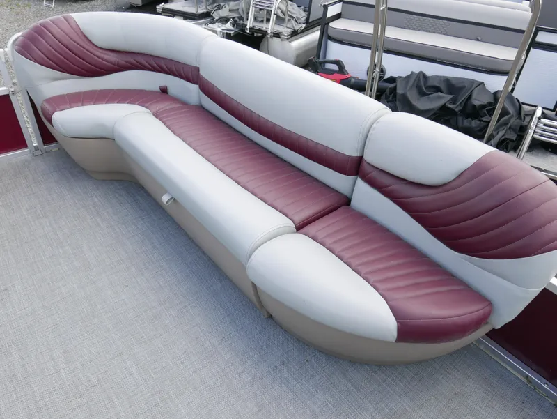 Slide: The Image of 2004 Tracker PB22OB pontoon boat seating with maroon and white upholstery. - 6