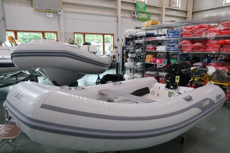 The Image of 2024 AB Inflatables Navigo 9 VS inflatable boat displayed in a showroom. - 0