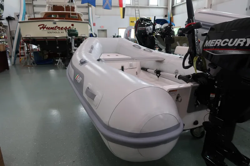 Slide: The Image of 2024 AB Inflatables Navigo 9 VS boat with Mercury engine in showroom. - 2