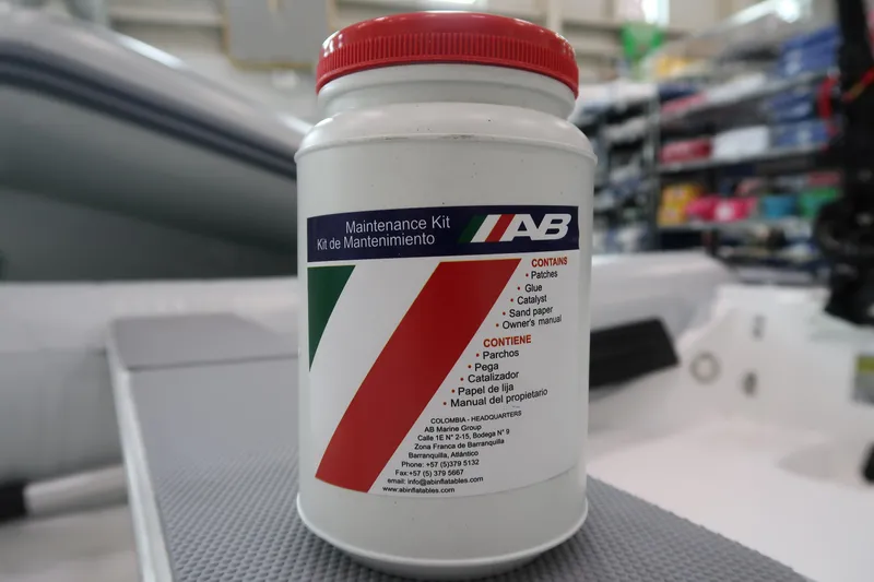 Slide: The Image of AB Inflatables Navigo 9 VS 2024 maintenance kit on boat deck. - 4