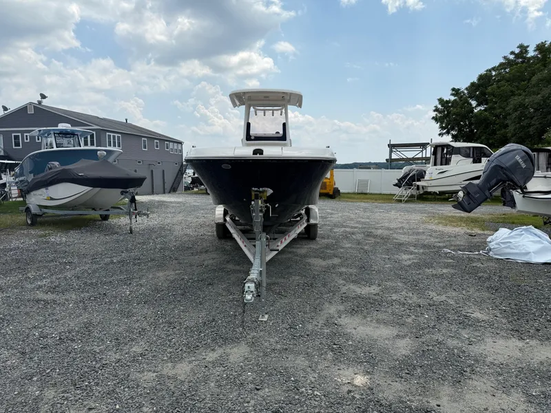 Slide: The Image of 2024 Bayliner Trophy T24CC boat on trailer in outdoor lot. - 22