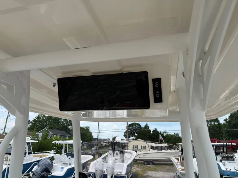 Slide: The Image of 2024 Bayliner Trophy T24CC boat console with electronic display and controls. - 32