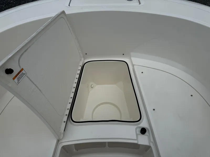 Slide: The Image of 2024 Bayliner Trophy T24CC boat storage compartment with open hatch. - 38