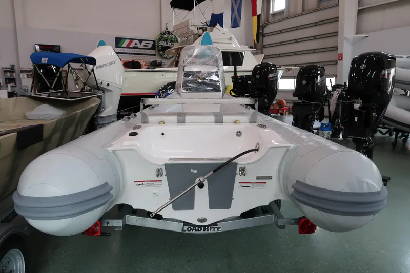 Slide: The Image of 2024 AB Inflatables Oceanus 14 VST boat displayed in a showroom. - 2