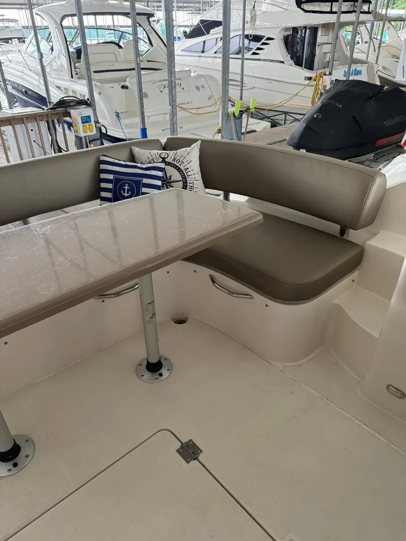 Slide: The Image of 2015 Carver C37 Coupe boat interior with seating and table. - 15