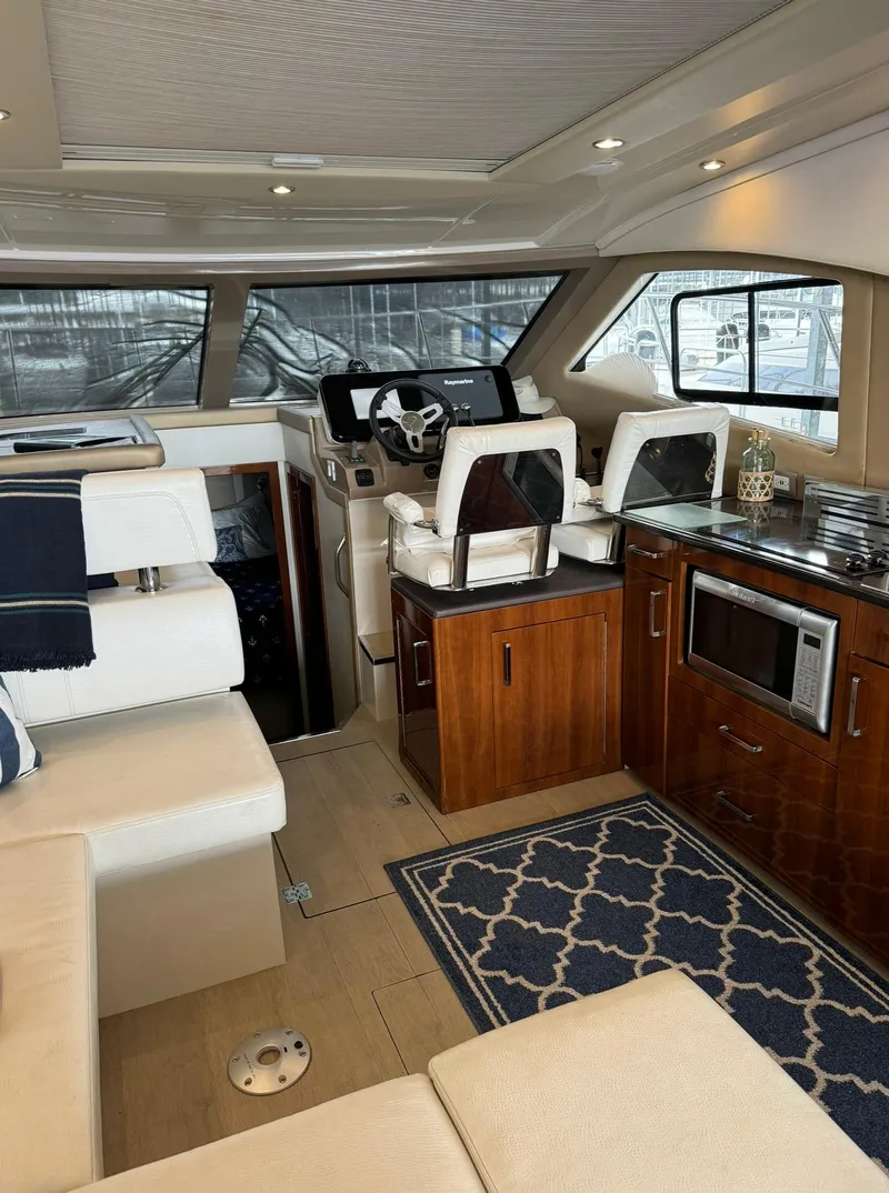 Slide: The Image of Interior of 2015 Carver C37 Coupe yacht with modern amenities and elegant design. - 23