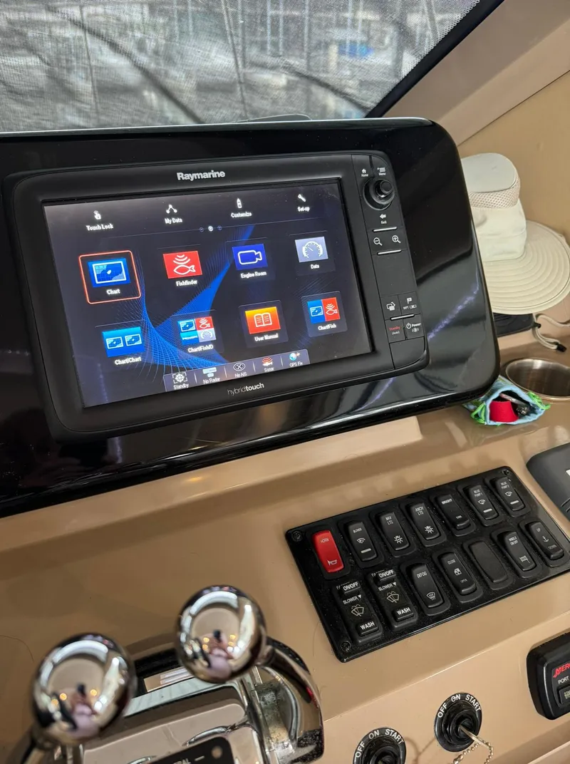 Slide: The Image of Control panel of a 2015 Carver C37 Coupe with Raymarine navigation system. - 27