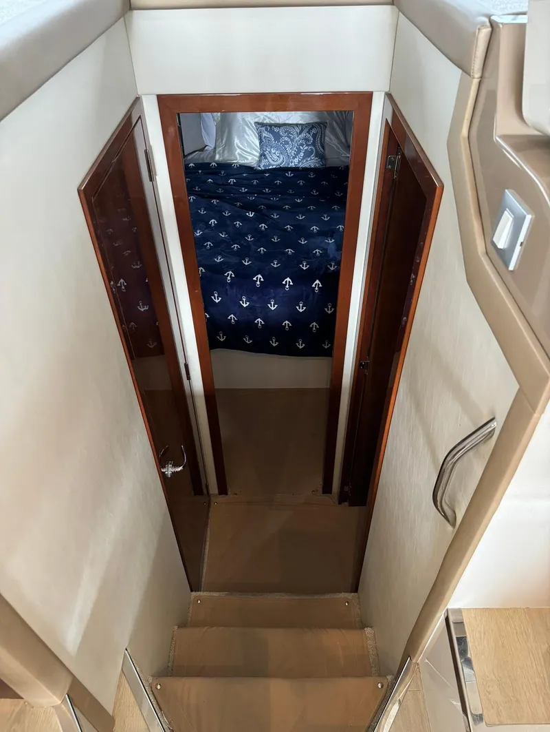 Slide: The Image of Interior view of 2015 Carver C37 Coupe yacht with stairs leading to bedroom. - 30