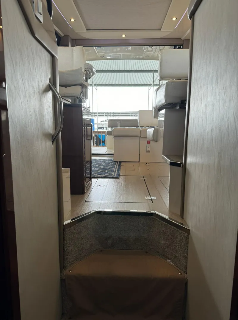 Slide: The Image of Interior view of 2015 Carver C37 Coupe yacht, showing modern living space. - 31