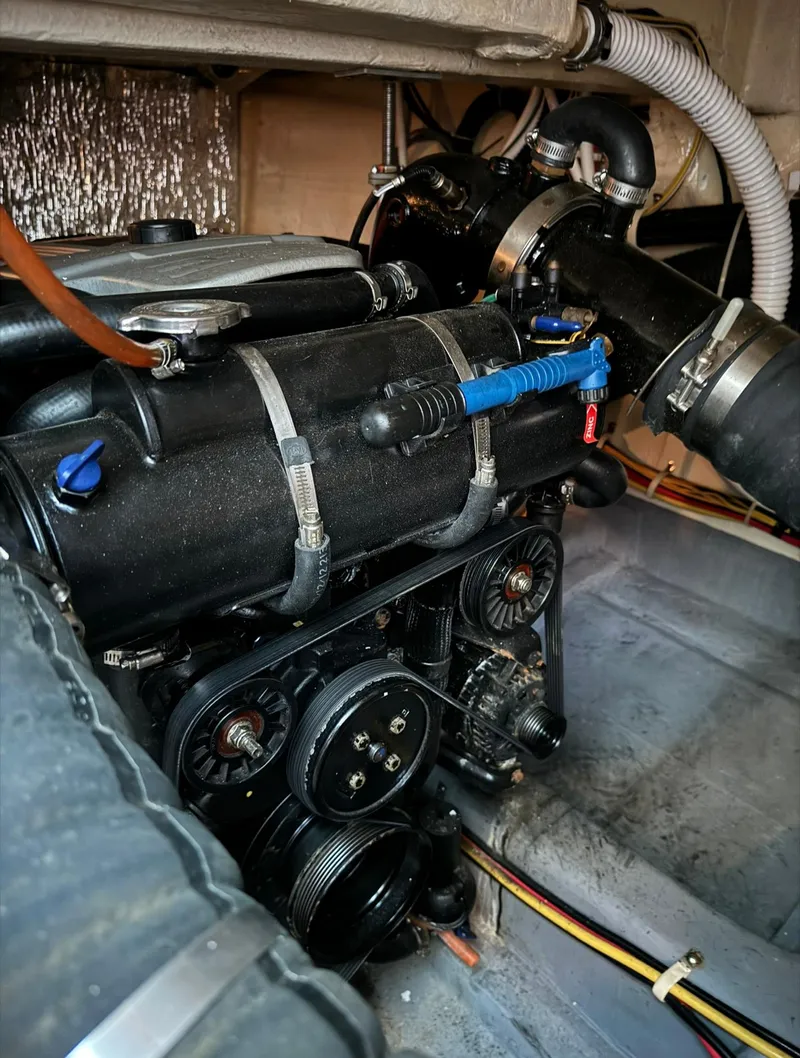 Slide: The Image of Engine compartment of a 2015 Carver C37 Coupe boat. - 42