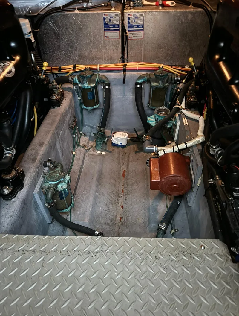 Slide: The Image of Engine compartment of a 2015 Carver C37 Coupe boat with visible components and wiring. - 44