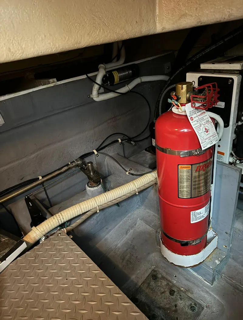 Slide: The Image of Engine room of 2015 Carver C37 Coupe with fire extinguisher. - 46