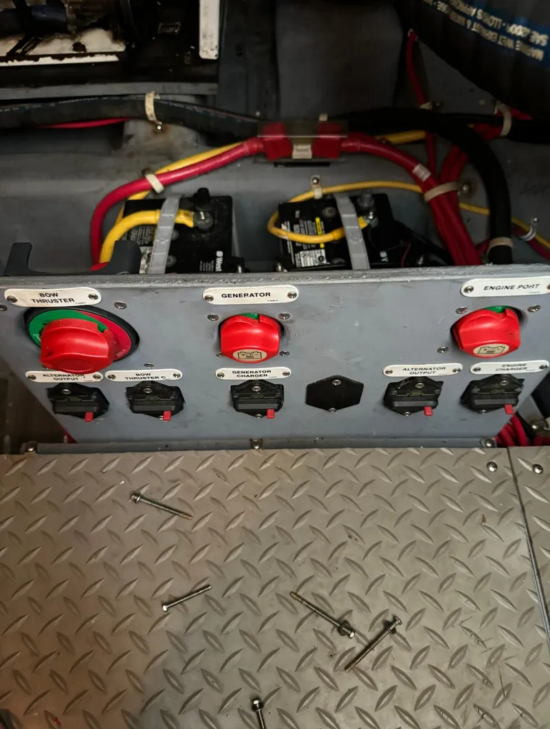 Slide: The Image of Electrical panel of a 2015 Carver C37 Coupe boat with wiring and switches. - 47