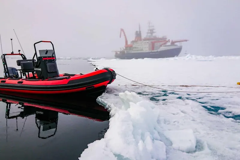 Slide: The Image of Highfield Patrol 500 in icy waters with ship in background, 2026. - 4