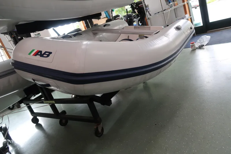 Slide: The Image of 2024 AB Inflatables Ventus 8 VL inflatable boat on display indoors. - 3