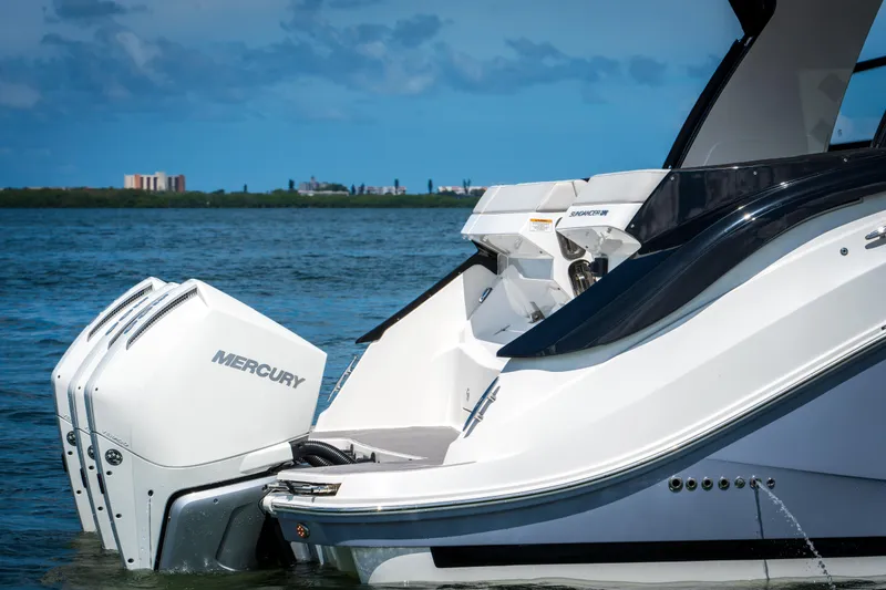 Slide: The Image of 2023 Sea Ray Sundancer 370 OB with Mercury outboard engines on the water. - 11