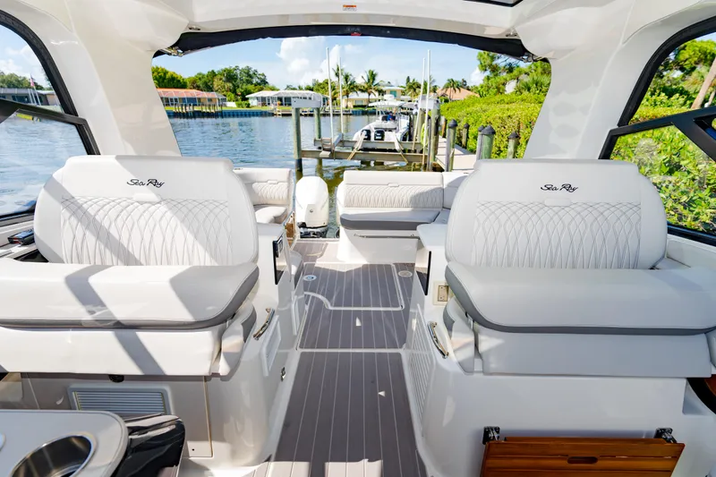 Slide: The Image of 2023 Sea Ray Sundancer 370 OB interior with waterfront view. - 17