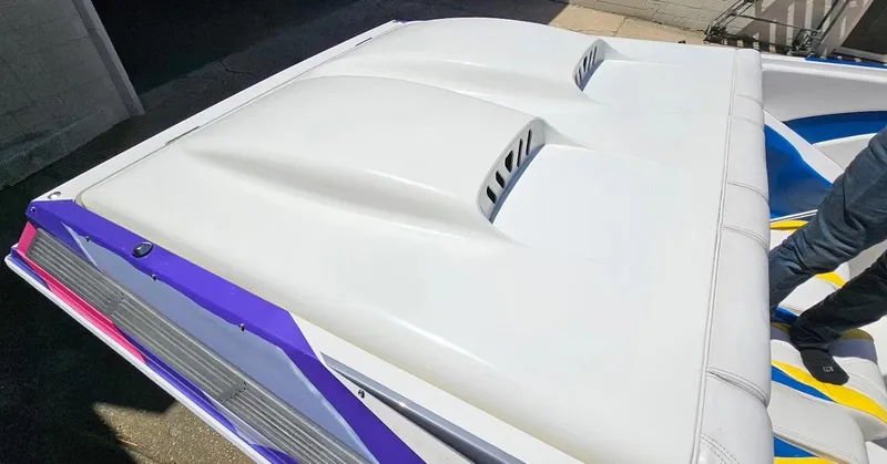Slide: The Image of 1997 Outerlimits 37 Stiletto boat rear deck with white and purple accents. - 11