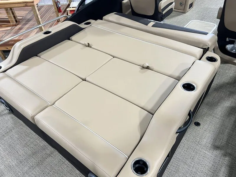 Slide: The Image of 2025 Barletta Cabrio C24UC boat interior with beige cushioned seating. - 31