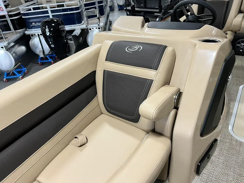 Slide: The Image of 2025 Barletta Cabrio C24UC boat interior with beige and black seating. - 4